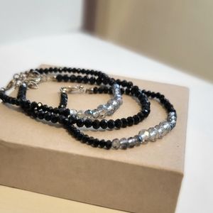 Pair of minimalist black faceted beaded stacking bracelets